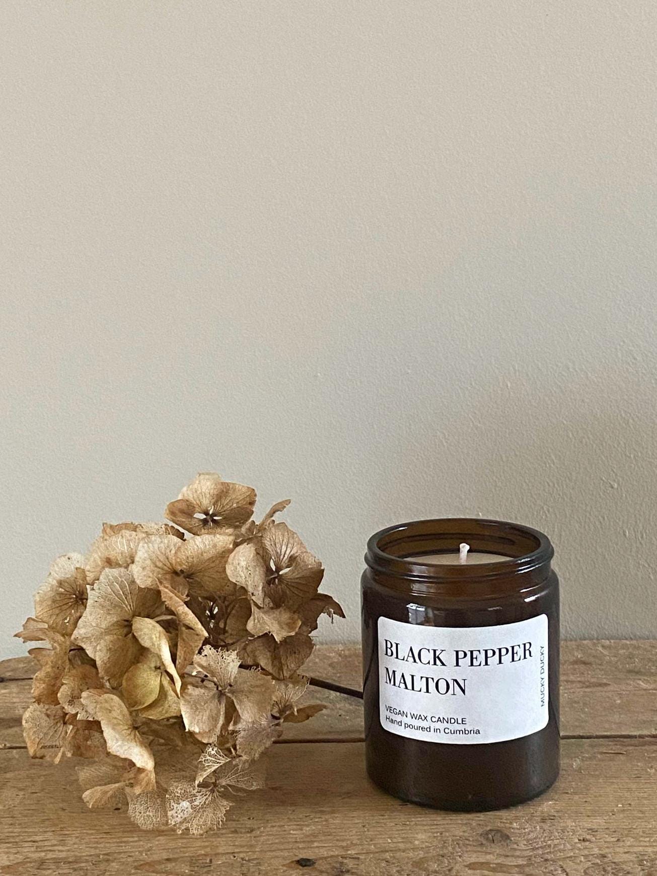 Hand poured Black Pepper vegan friendly candle in a glass container